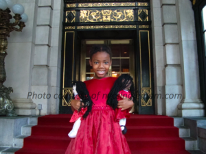 My Daughter holding her Best Pals dolls in front of the Plaza 