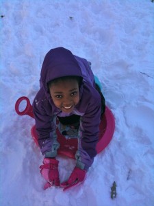 Sledding in Central Park near the Metropolitan Museum 