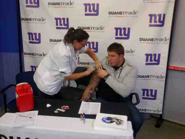 New York Giants David Diehl Getting a Flu Shot at Duane Reade Where to get a Flu Shot in New York, Flu Shot New York