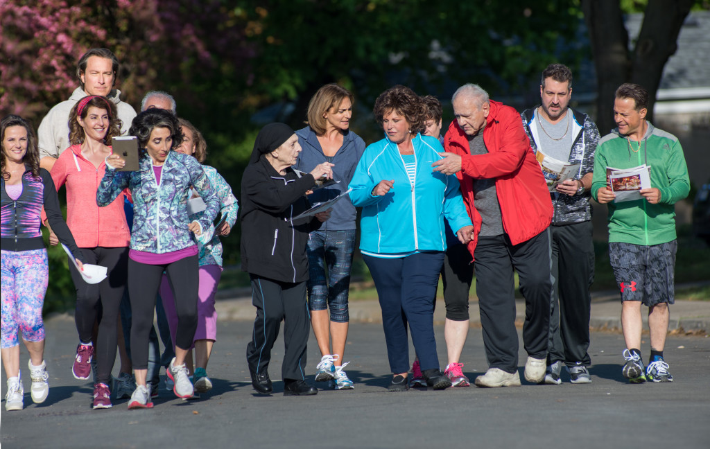 (L to R) Cousin Nikki (GIA CARIDES), Toula (NIA VARDALOS), Ian (JOHN CORBETT), Aunt Voula (ANDREA MARTIN), Uncle Taki (GERRY MENDICINO), Aunt Freida (MARIA VACRATSIS), Mana-Yiayia (BESS MEISLER), Athena (STAVROULA LOGOTHETTIS), Maria (LAINIE KAZAN), Cousin Marianthi (KATHRYN HAGGIS), Gus (MICHAEL CONSTANTINE), Cousin Angelo (JOEY FATONE) and Nick (LOUIS MANDYLOR) return in "My Big Fat Greek Wedding 2," the highly anticipated follow-up to the highest-grossing romantic comedy of all time.